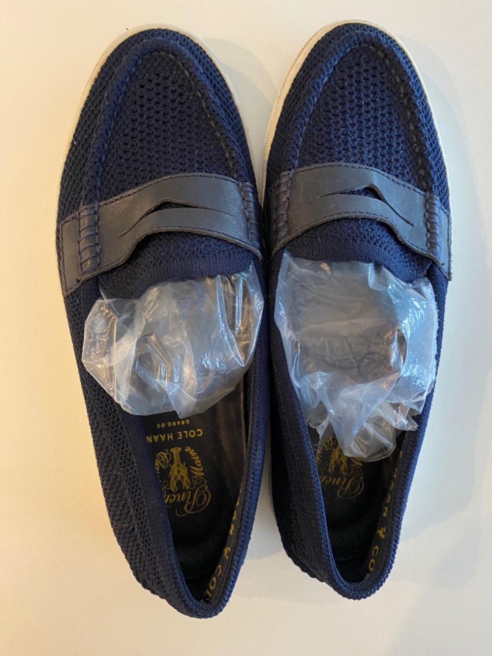 Cole Haan Navy slip ons